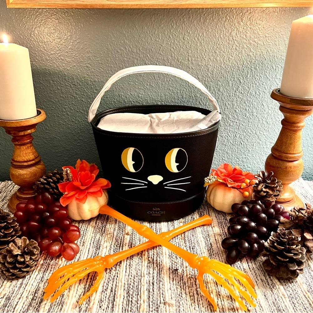 Trick Or Treat Bucket In Signature Canvas With coated canvas and smooth leather.